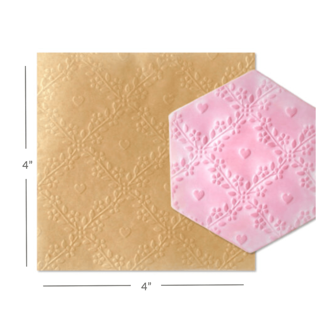 https://www.thecookiecountess.com/cdn/shop/files/intricut-edibles-parchment-paper-parchment-texture-sheets-heart-lattice-31508615266361_1200x1200.png?v=1685604784